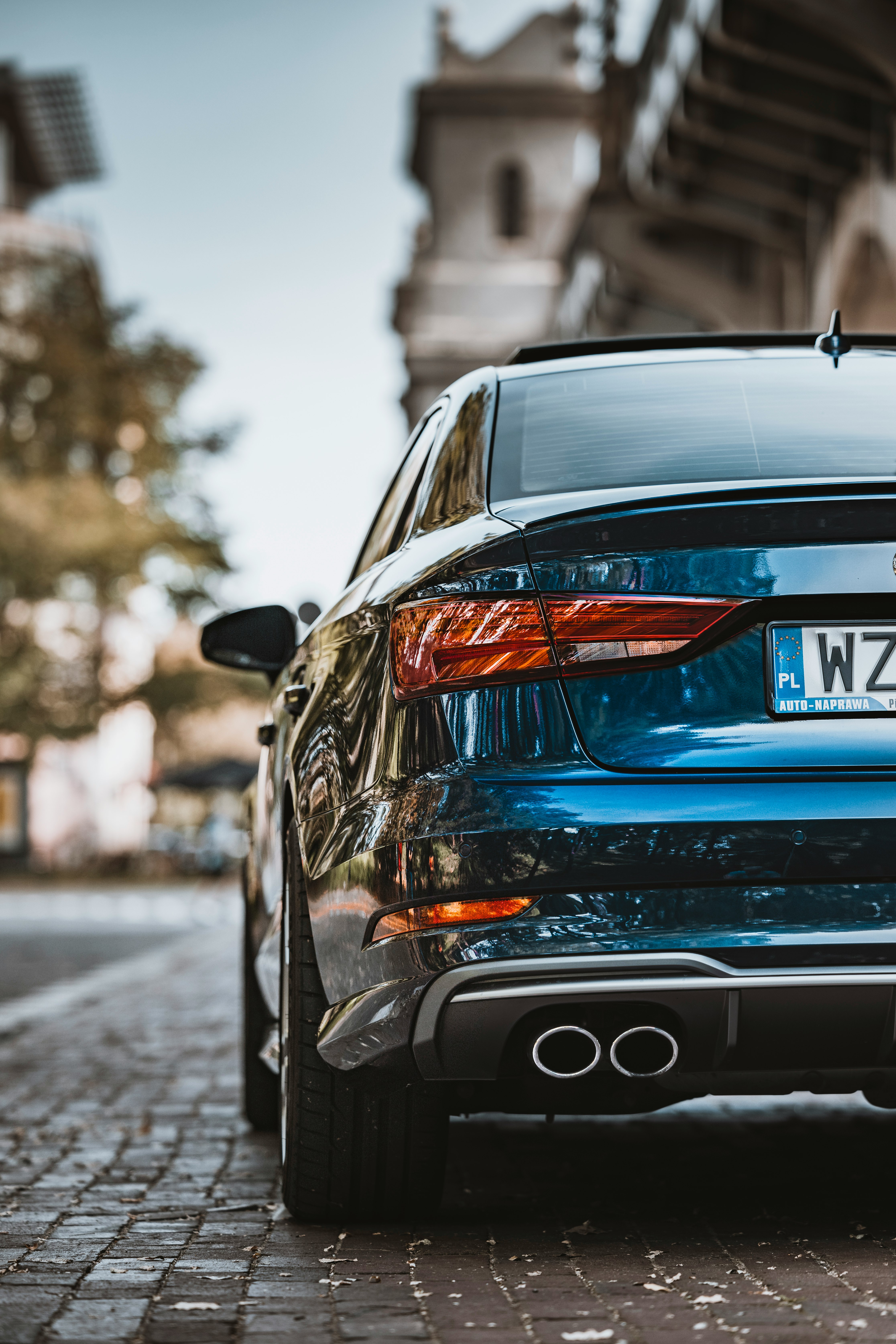 blue car on road during daytime